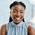 Confident black businesswoman working in an office alone